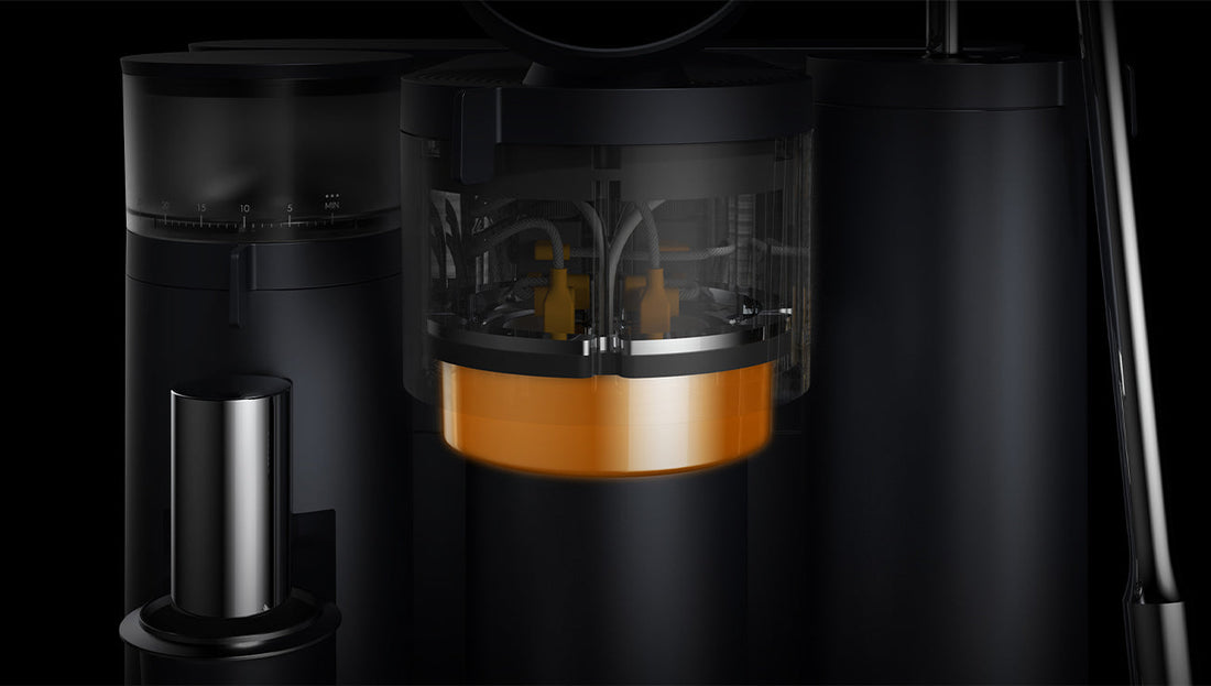 Close-up of the smart espresso machine's internal mechanism, showing a transparent water or brewing chamber with glowing orange components inside.