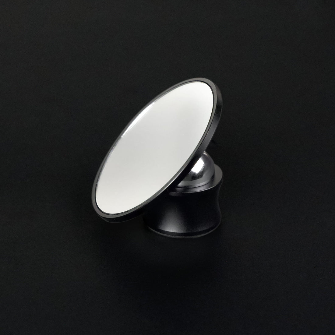 Round Meraki espresso shot mirror on an adjustable black stand