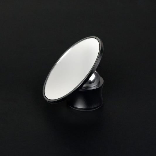 Round Meraki espresso shot mirror on an adjustable black stand
