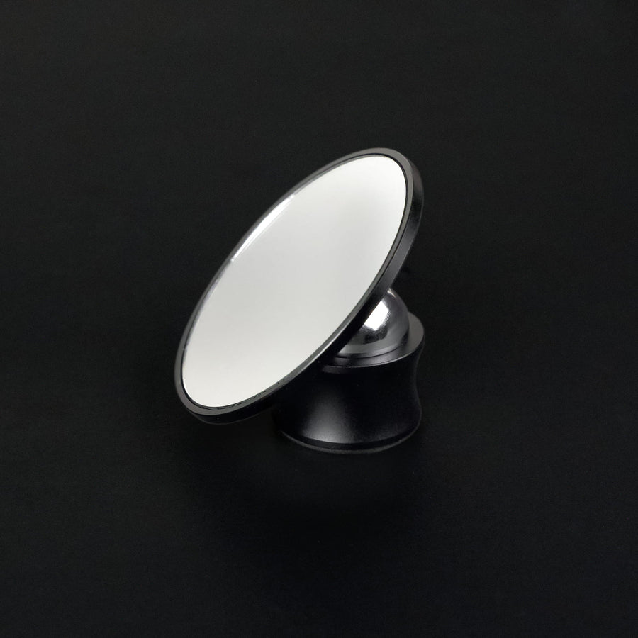 Round Meraki espresso shot mirror on an adjustable black stand