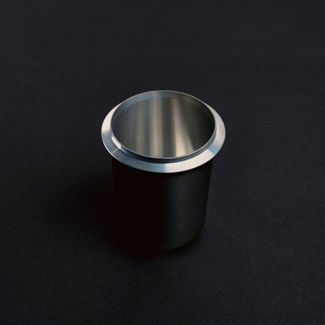 Black Meraki dosing cup for weighing and transferring espresso coffee