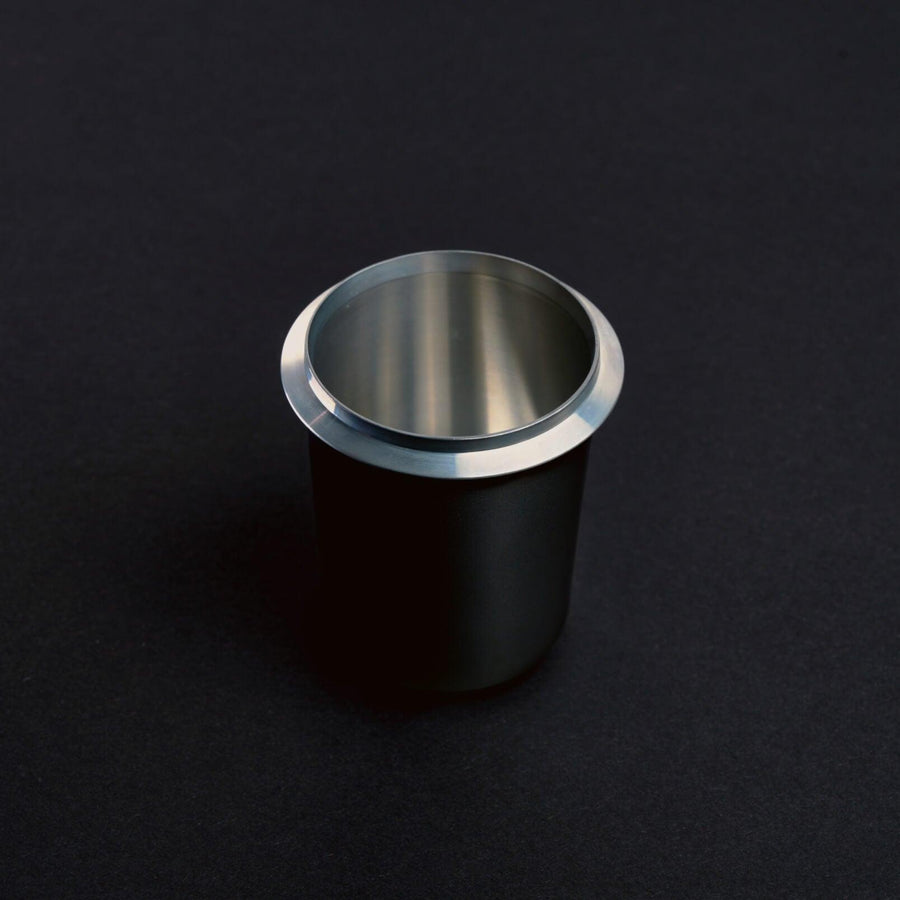 Black Meraki dosing cup for weighing and transferring espresso coffee