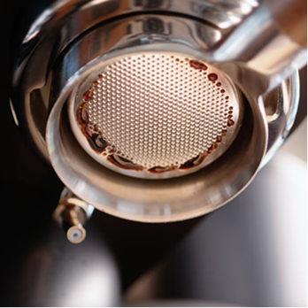 Espresso channeling causing uneven streams from a bottomless portafilter