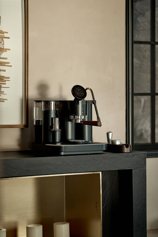 Meraki high-end espresso machine presented in a restrained modern interior