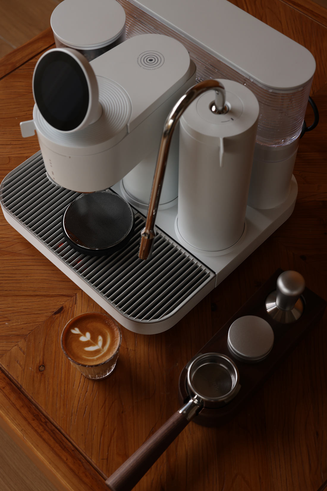 Meraki espresso machine and a finished drink on a home coffee bar