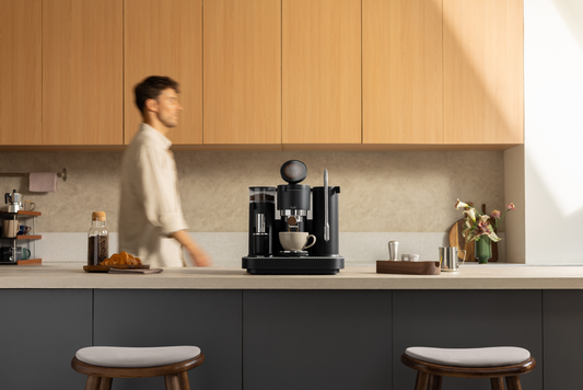 Black Meraki espresso machine in an everyday home kitchen setting