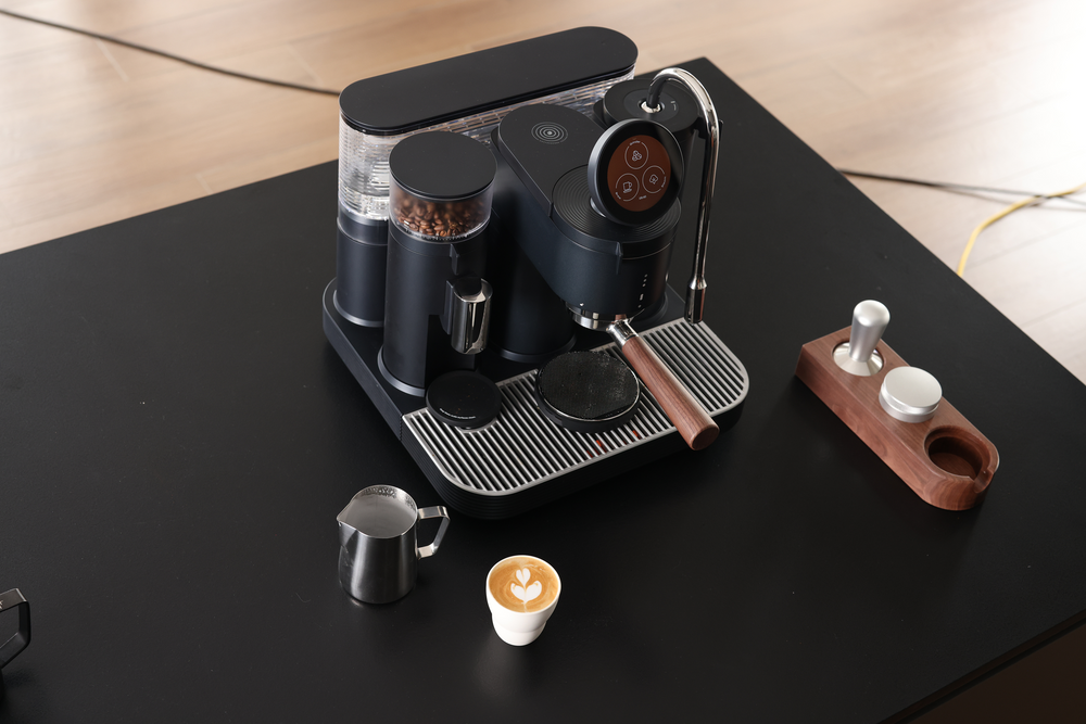 Meraki espresso machine and portafilter accessories arranged for a home coffee setup