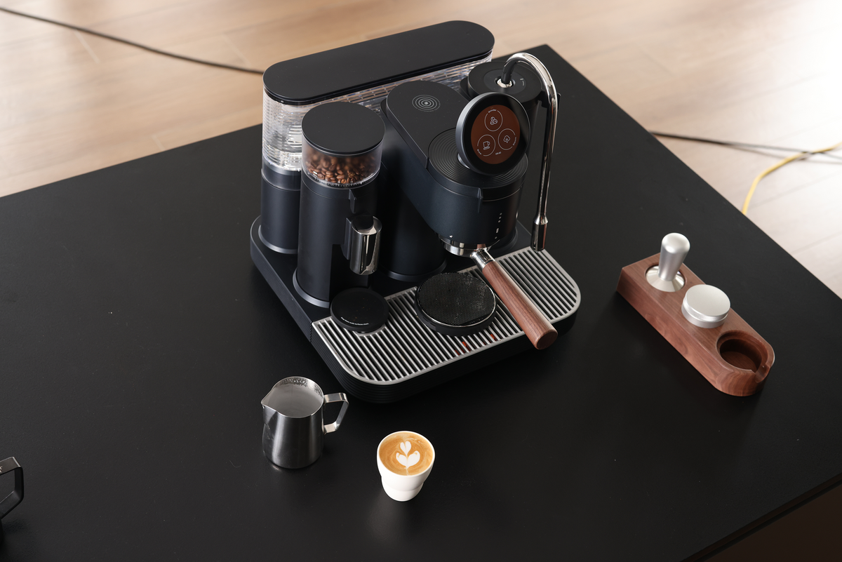 Meraki espresso machine and portafilter accessories arranged for a home coffee setup