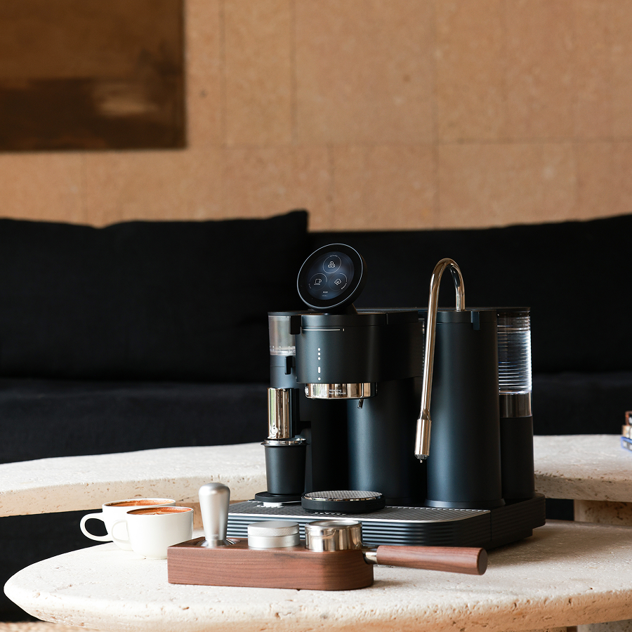 Meraki espresso machine on a shared office counter