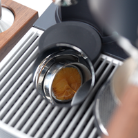 Meraki espresso machine: rich golden espresso with vibrant crema, showcasing brewing artistry.