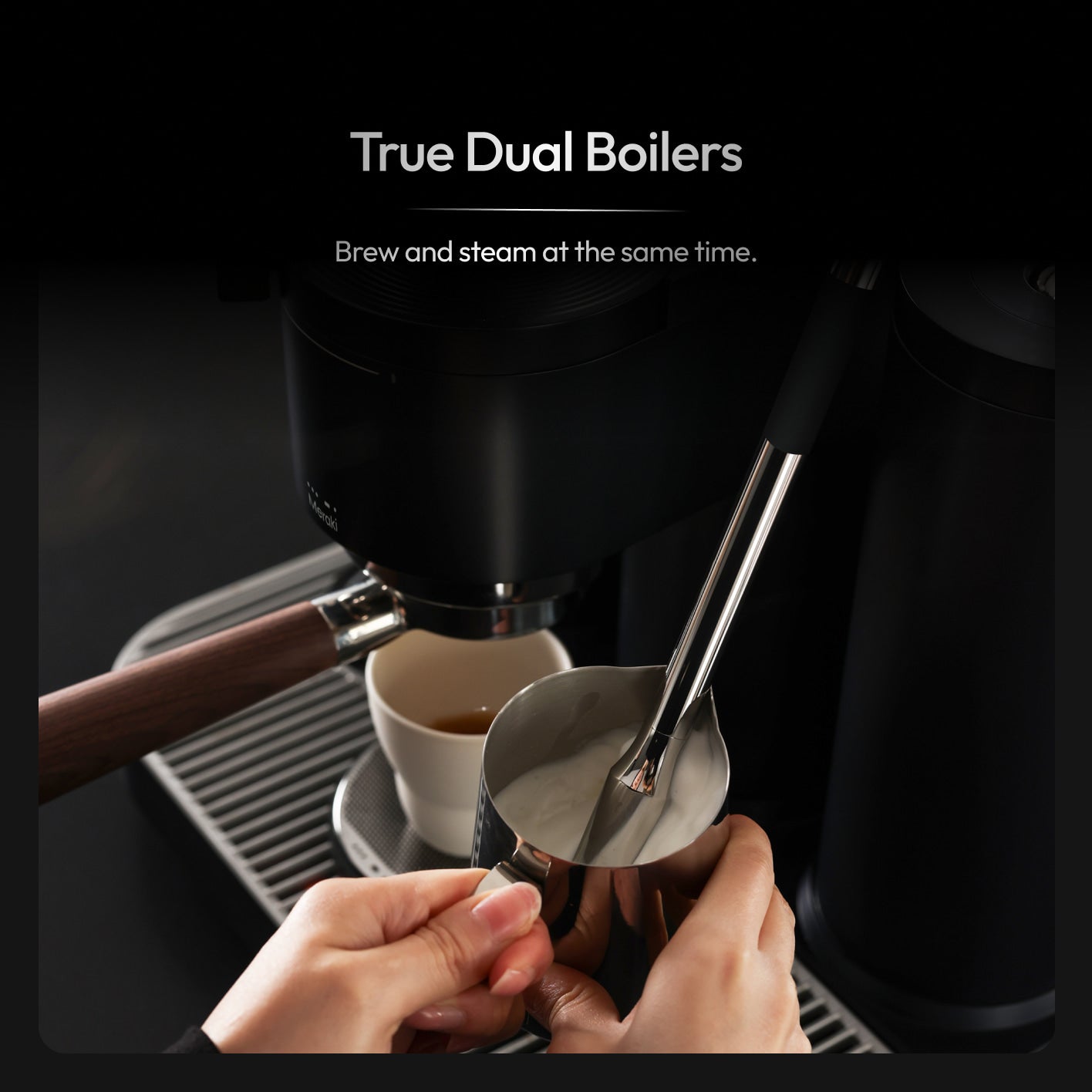 Dual boiler espresso machine pulling an espresso shot while steaming milk at the same time