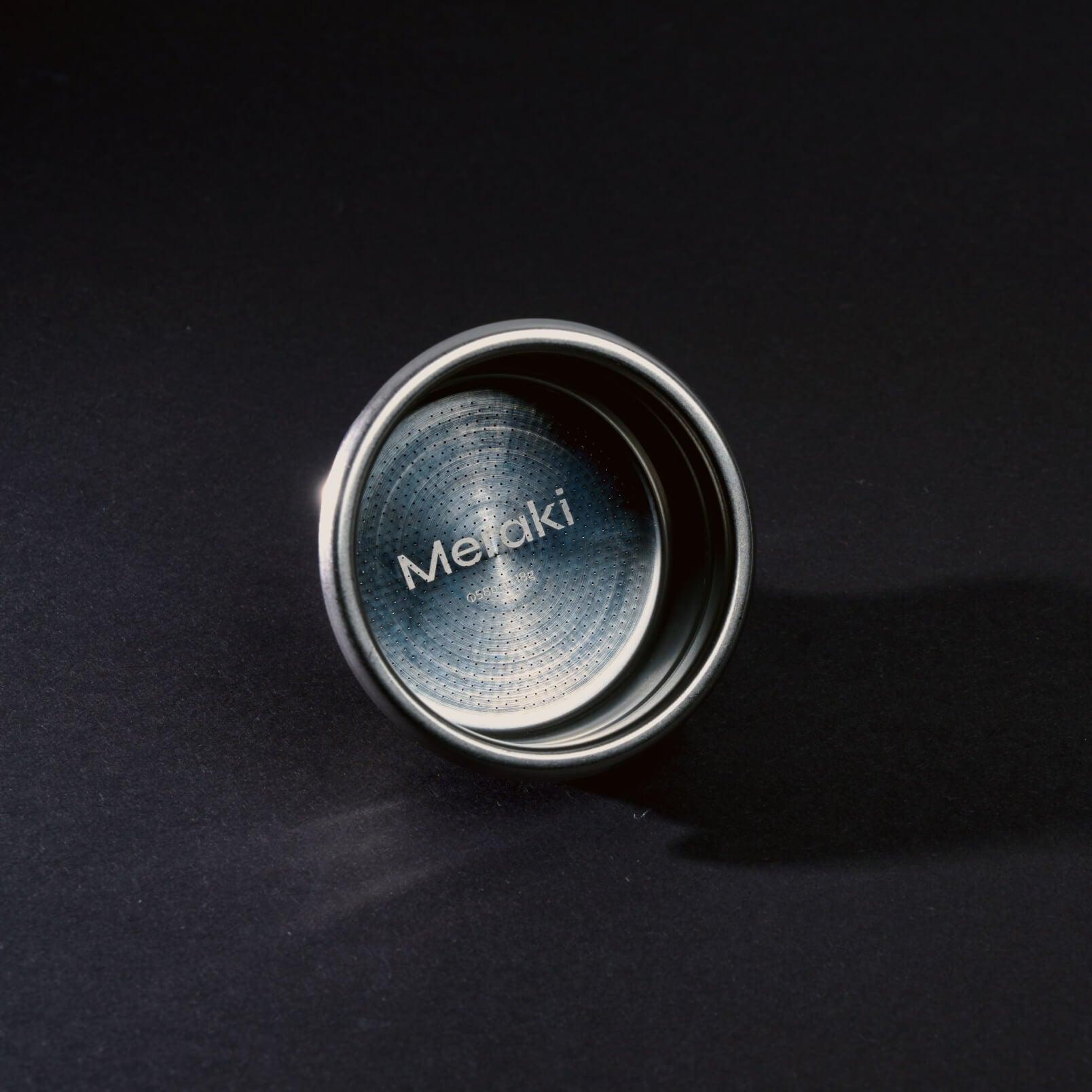 Meraki 58mm portafilter basket, 18g, stainless steel construction, precise perforations, engraved logo.