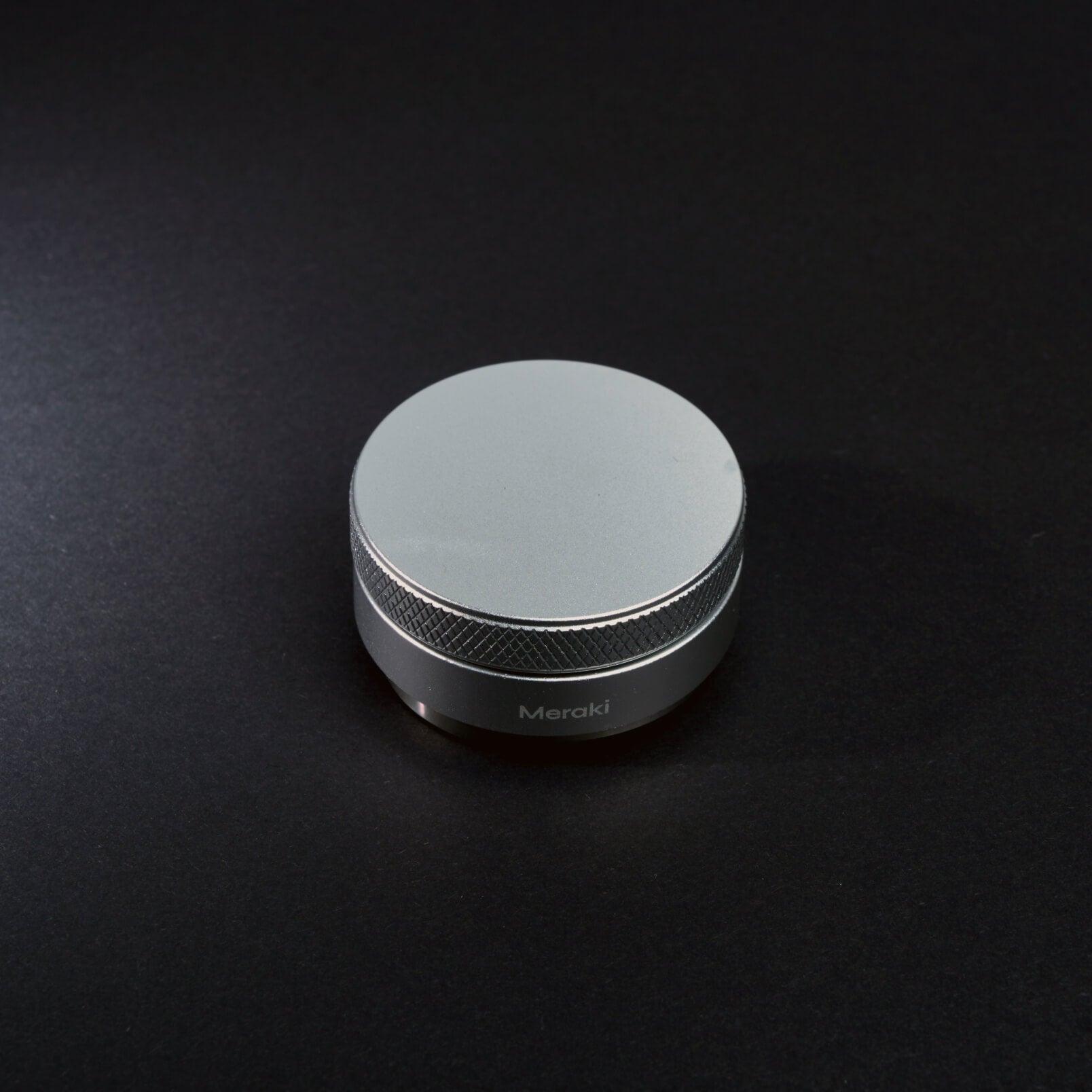 Side view of the adjustable Meraki coffee distributor for espresso puck preparation