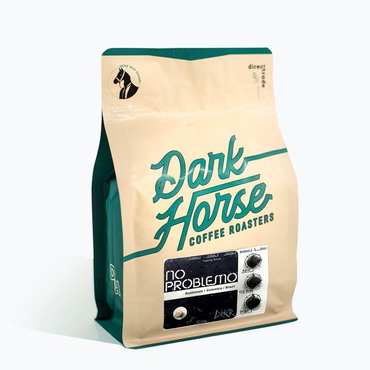 Dark Horse Coffee Roasters "NO PROBLEMO" blend bag, featuring Guatemala, Colombia, and Brazil beans.