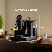 Compact professional espresso machine with dimensions and coffee accessories on a wooden counter.