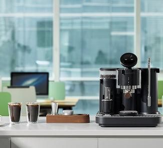 Professional dual boiler espresso setup in a modern office breakroom for premium coffee breaks.