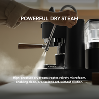 Meraki espresso machine steam wand in use. Powerful, dry steam— creates velvety microfoam for latte art without dilution.